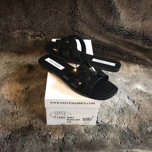 Steve Madden Sicily black leather slide sandals.